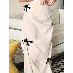 Elegant Cream Maxi Skirt with Black Bow Accents